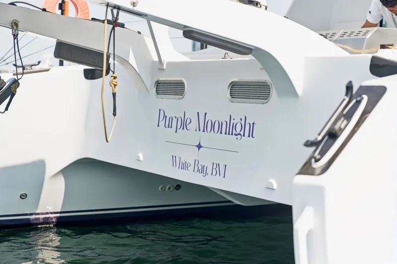 Slide: The Image of Sailing catamaran "Purple Moonlight" docked at White Bay, BVI, Balance 526, 2025 model. - 112