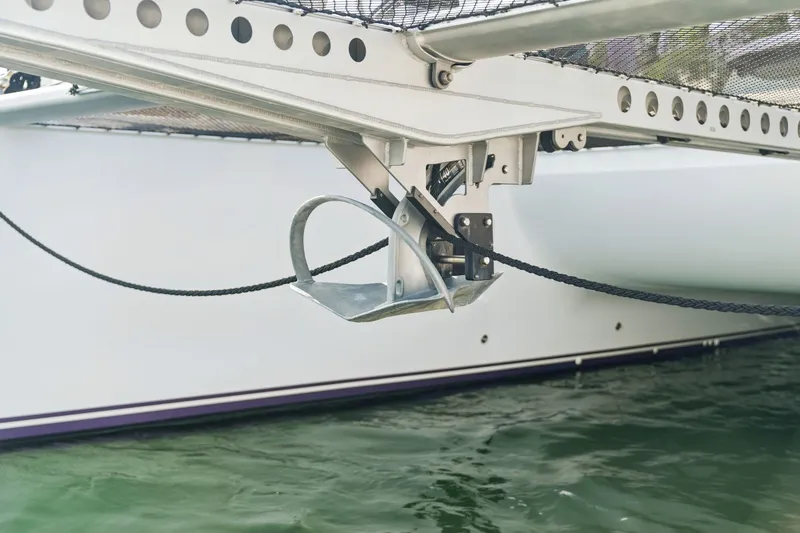 Slide: The Image of Close-up of a Balance 526 catamaran anchor mechanism, 2025 model, above water. - 132