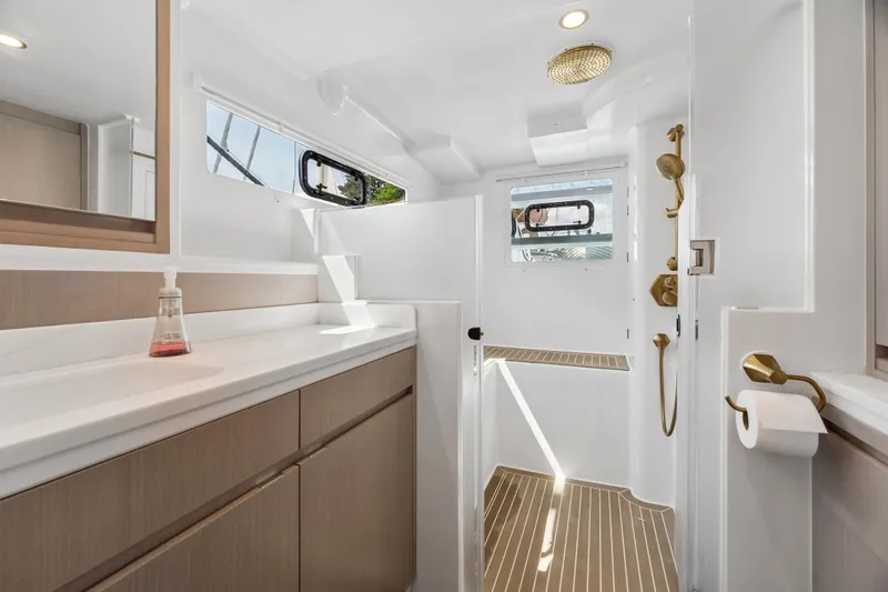 Slide: The Image of Modern bathroom interior on Balance 526 yacht, featuring sleek design and gold fixtures, 2025 model. - 63