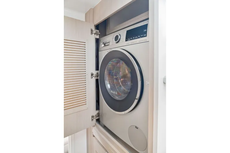 Slide: The Image of Front-loading Balance 526 washing machine in a cabinet, 2025 model. - 107