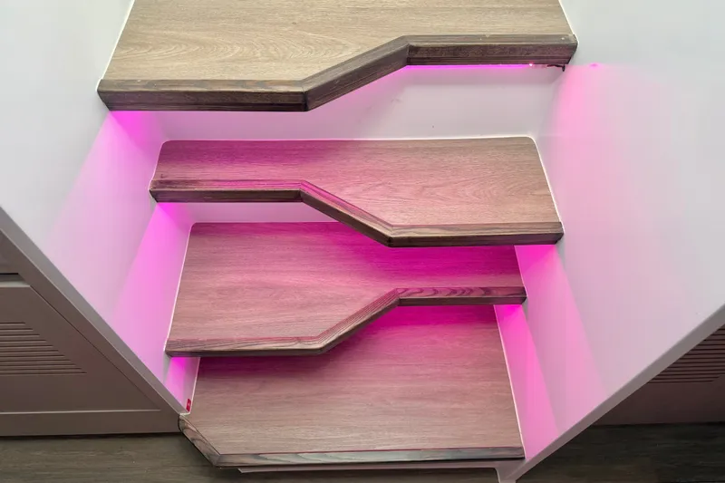 Slide: The Image of Modern wooden stairs with pink LED lighting, Balance 526 model, 2025 design. - 109