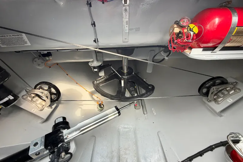 Slide: The Image of Interior view of Balance 526 yacht's mechanical system, featuring cables and a fire extinguisher. - 92