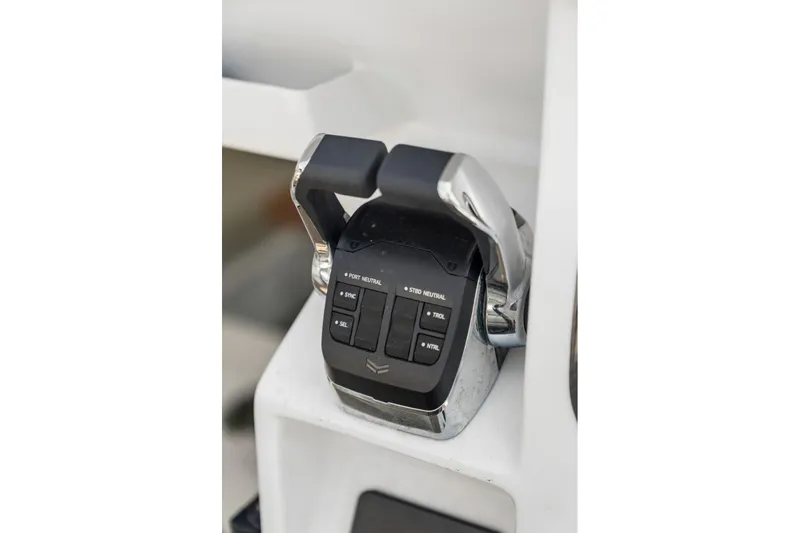 Slide: The Image of Throttle control panel of Balance 526 yacht, 2025 model, featuring dual levers and control buttons. - 32