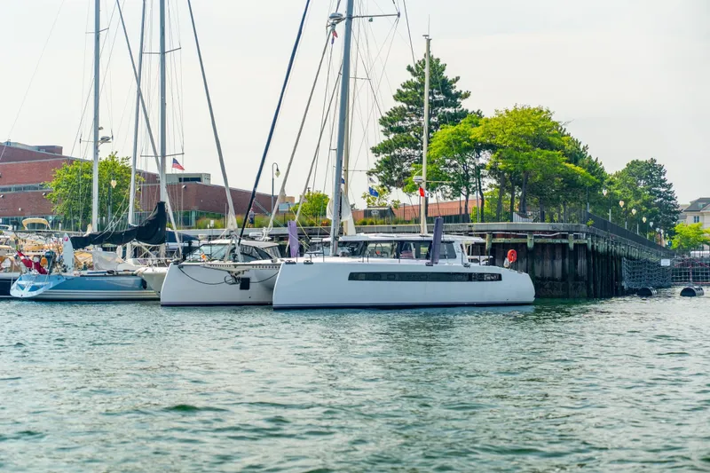 Slide: The Image of Sailboats docked at a marina, featuring a 2025 Balance 526 model. - 135