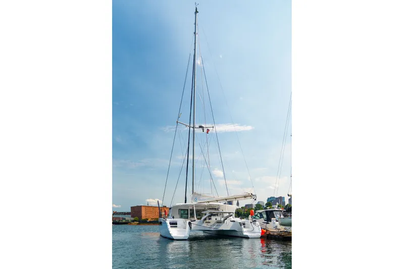 Slide: The Image of Sleek Balance 526 catamaran docked in sunny harbor, 2025 model. - 134