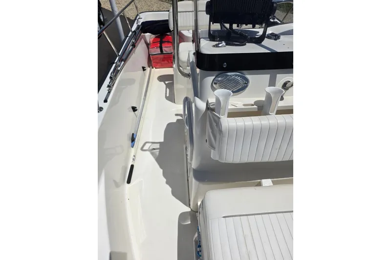 Slide: The Image of 2011 Boston Whaler 170 Montauk interior with seating and storage compartments. - 14