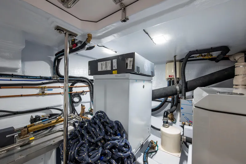Slide: The Image of Engine room of 2026 Kadey-Krogen 60 Open yacht with equipment and cables. - 69