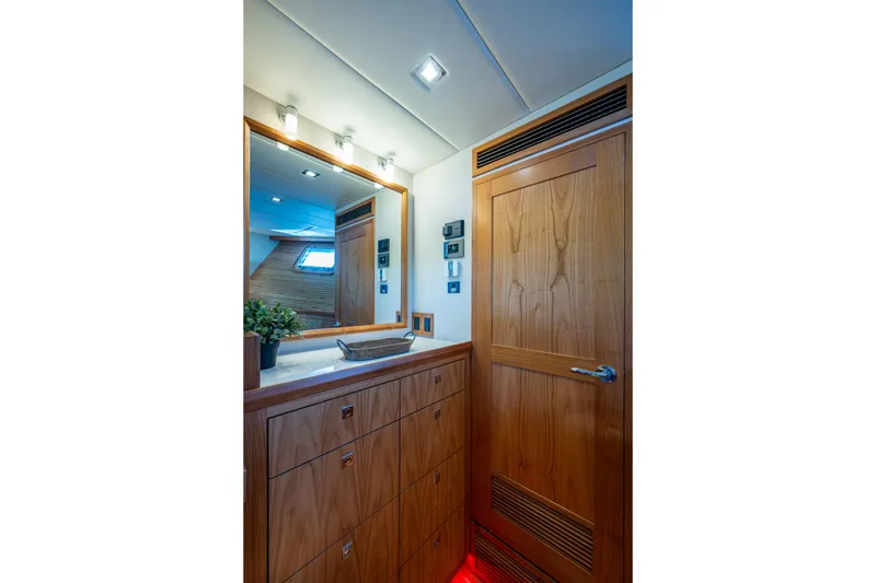 Slide: The Image of Luxurious Kadey-Krogen 60 Open 2026 yacht interior with wooden cabinetry and modern lighting. - 40