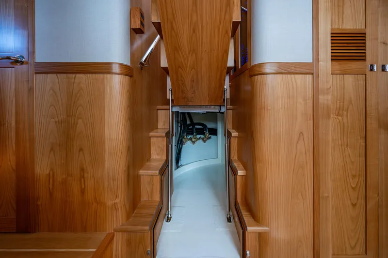 Slide: The Image of Interior of 2026 Kadey-Krogen 60 Open yacht with wooden stairs and paneling. - 53