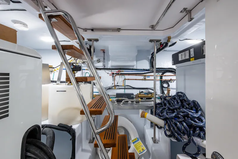 Slide: The Image of Engine room of 2026 Kadey-Krogen 60 Open yacht with equipment and ladder. - 68