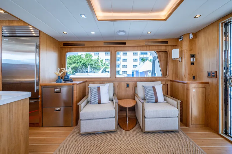 Slide: The Image of Luxurious interior of 2026 Kadey-Krogen 60 Open yacht with modern seating and wood finishes. - 4