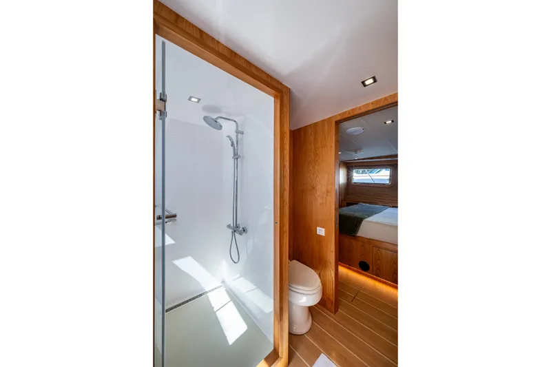 Slide: The Image of Luxurious bathroom in 2026 Kadey-Krogen 60 Open yacht with modern shower and wooden accents. - 35