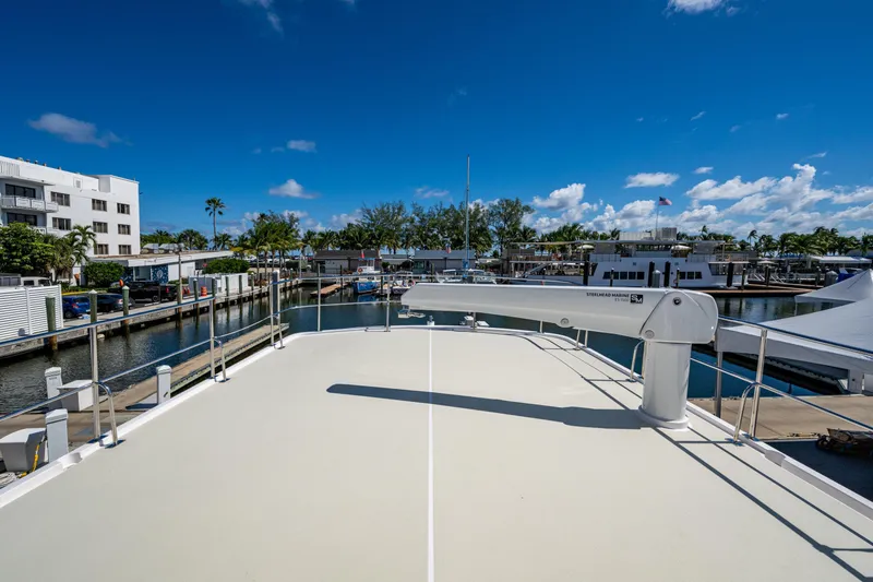 Slide: The Image of Kadey-Krogen 60 Open 2026 yacht docked at marina under clear blue sky. - 96