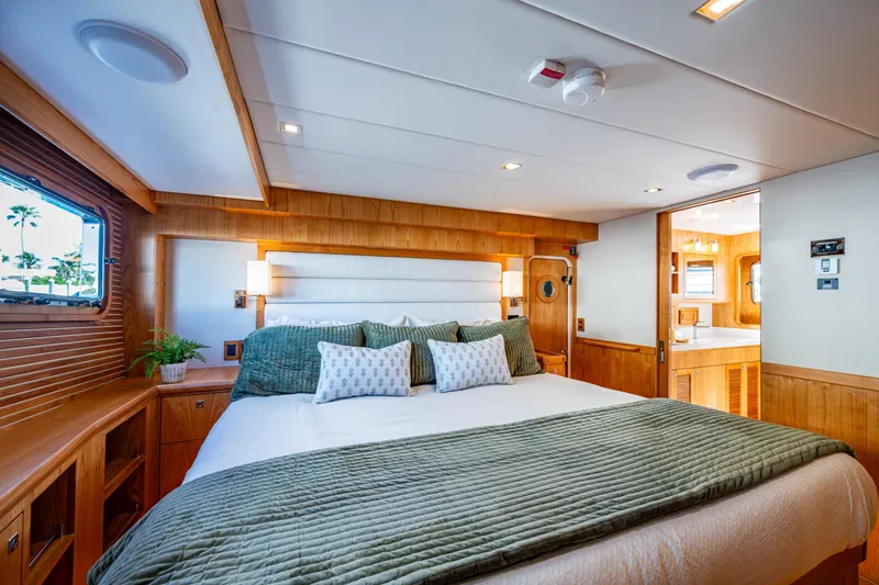 Slide: The Image of Luxurious bedroom interior of 2026 Kadey-Krogen 60 Open yacht with elegant wood finishes. - 26