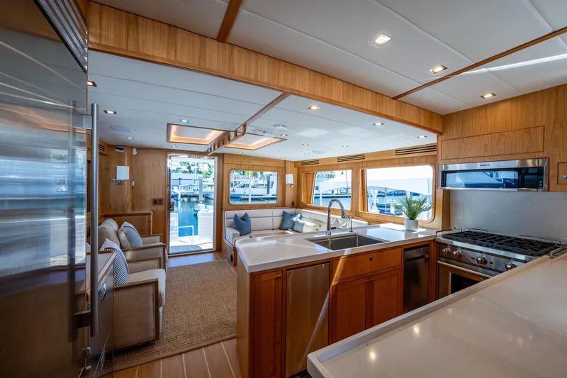 Slide: The Image of Luxurious interior of 2026 Kadey-Krogen 60 Open yacht with modern kitchen and seating area. - 7