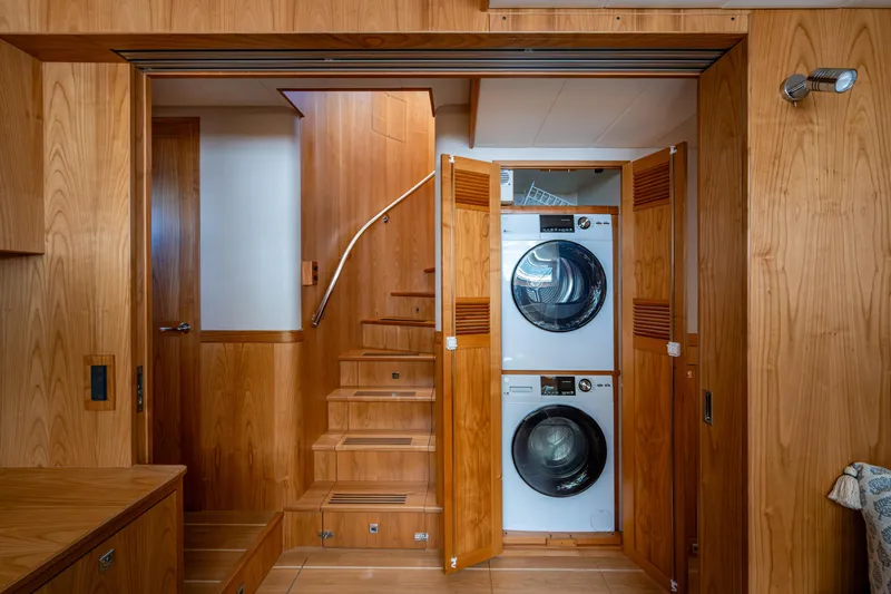 Slide: The Image of Laundry area with stacked washer and dryer in 2026 Kadey-Krogen 60 Open yacht. - 52