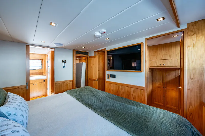 Slide: The Image of Luxurious cabin interior of 2026 Kadey-Krogen 60 Open yacht with wood paneling and modern amenities. - 28