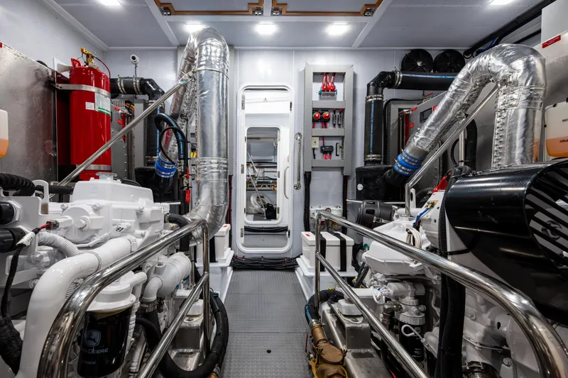 Slide: The Image of Engine room of 2026 Kadey-Krogen 60 Open yacht, featuring advanced machinery and equipment. - 55