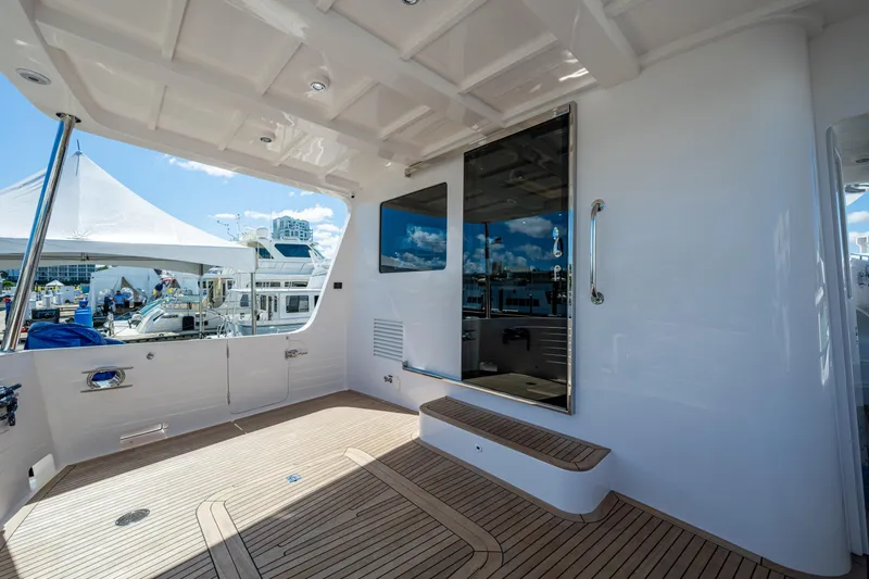 Slide: The Image of Spacious deck of 2026 Kadey-Krogen 60 Open yacht with modern design and wood flooring. - 73