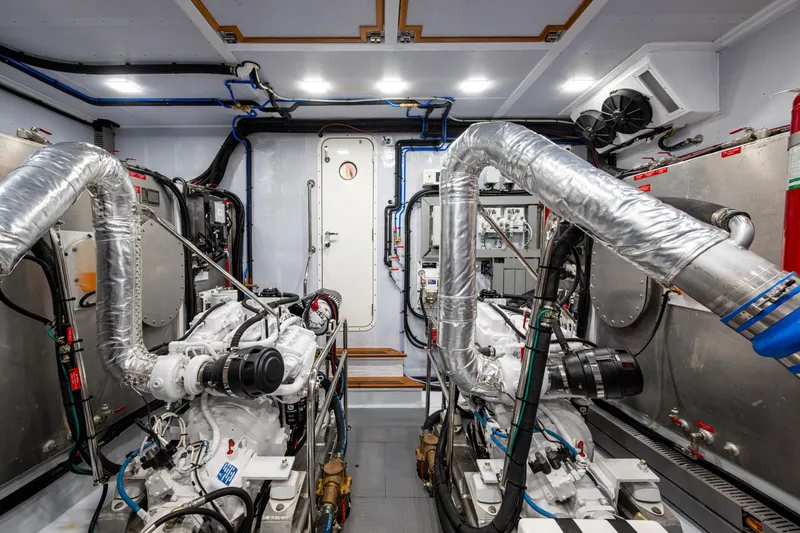 Slide: The Image of Engine room of 2026 Kadey-Krogen 60 Open yacht, featuring advanced machinery and piping. - 61