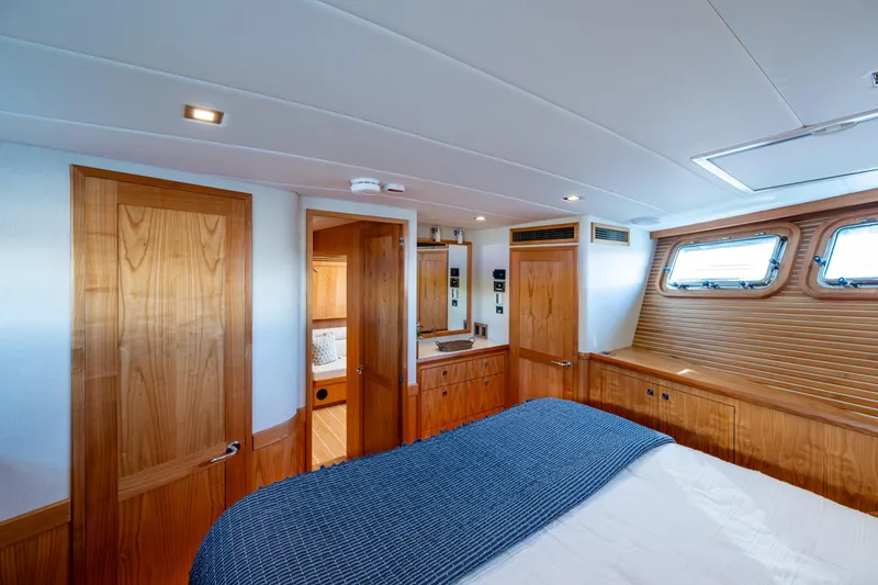 Slide: The Image of Luxurious cabin interior of 2026 Kadey-Krogen 60 Open yacht with wood finishes. - 38