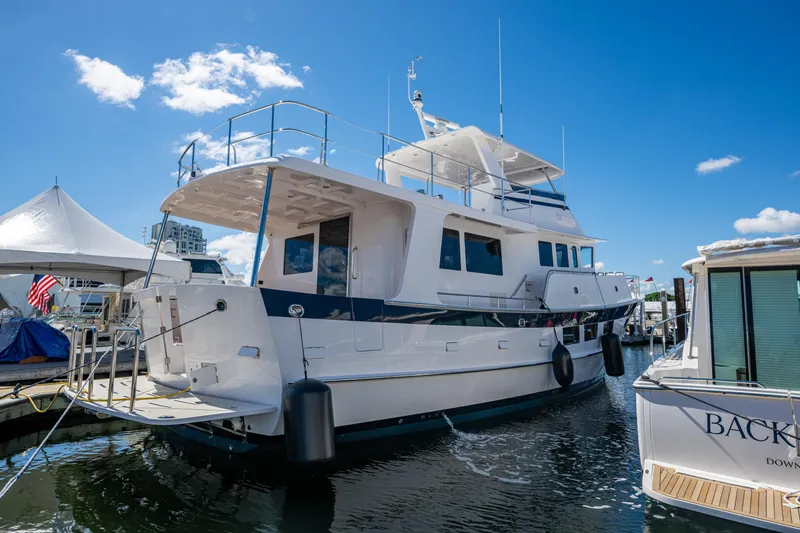 Slide: The Image of Kadey-Krogen 60 Open 2026 yacht docked under a clear blue sky. - 104