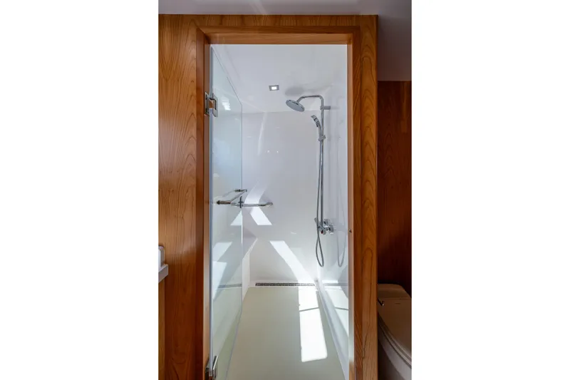 Slide: The Image of Modern shower in 2026 Kadey-Krogen 60 Open yacht, featuring sleek glass door and chrome fixtures. - 36