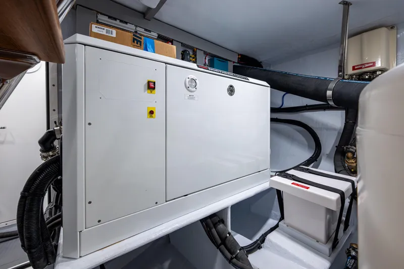 Slide: The Image of Engine room of 2026 Kadey-Krogen 60 Open yacht, featuring modern equipment and wiring. - 71