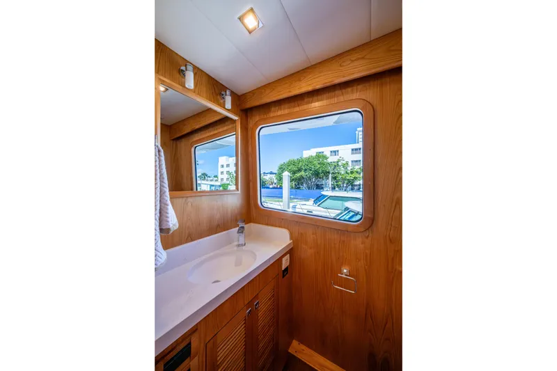 Slide: The Image of Luxurious bathroom interior of 2026 Kadey-Krogen 60 Open yacht with wooden finish. - 15
