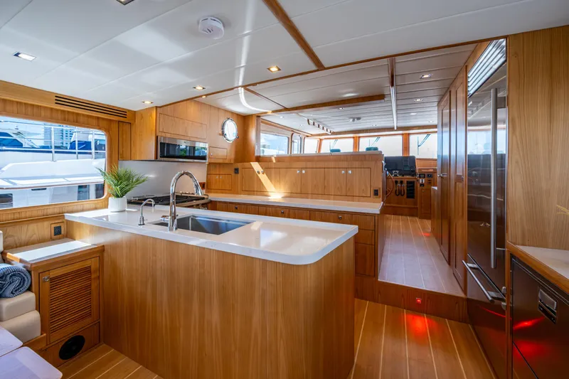 Slide: The Image of Luxurious interior of 2026 Kadey-Krogen 60 Open yacht with modern kitchen design. - 6