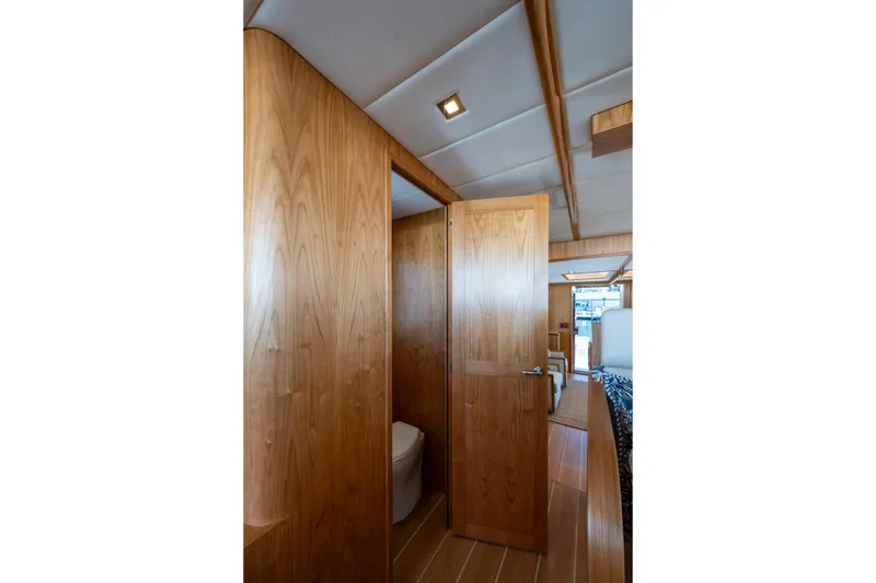 Slide: The Image of Luxurious wooden interior of 2026 Kadey-Krogen 60 Open yacht bathroom. - 14