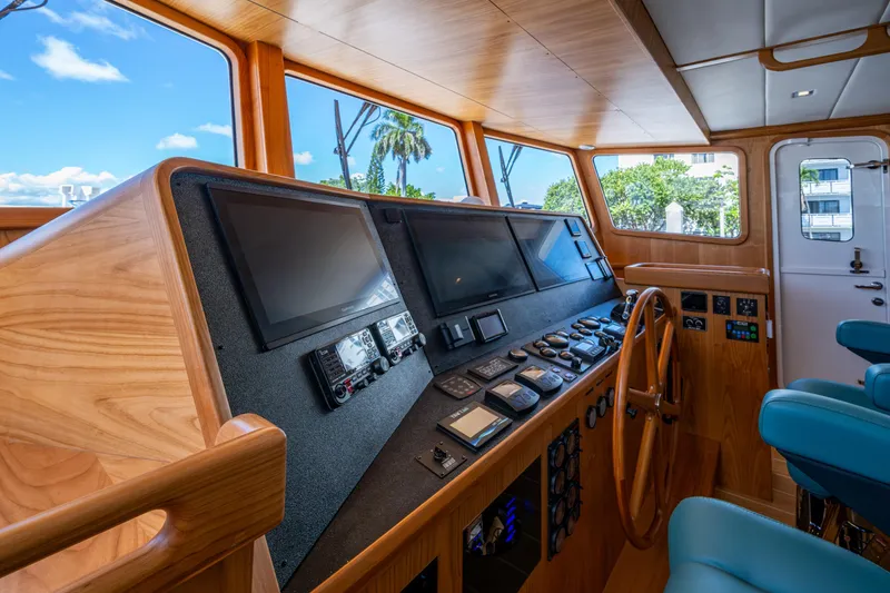 Slide: The Image of Pilothouse of 2026 Kadey-Krogen 60 Open yacht with modern navigation equipment. - 22