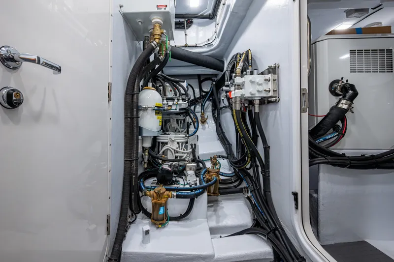 Slide: The Image of Engine room of 2026 Kadey-Krogen 60 Open yacht, showcasing complex piping and machinery. - 66
