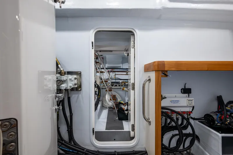 Slide: The Image of Engine room of 2026 Kadey-Krogen 60 Open yacht, showcasing equipment and wiring. - 65