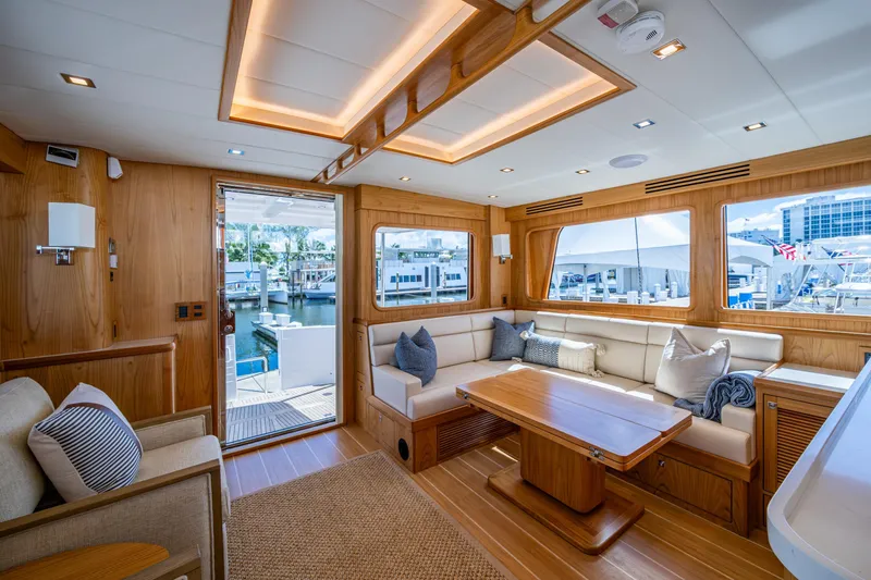 Slide: The Image of Luxurious interior of 2026 Kadey-Krogen 60 Open yacht with elegant wood finishes and spacious seating. - 1