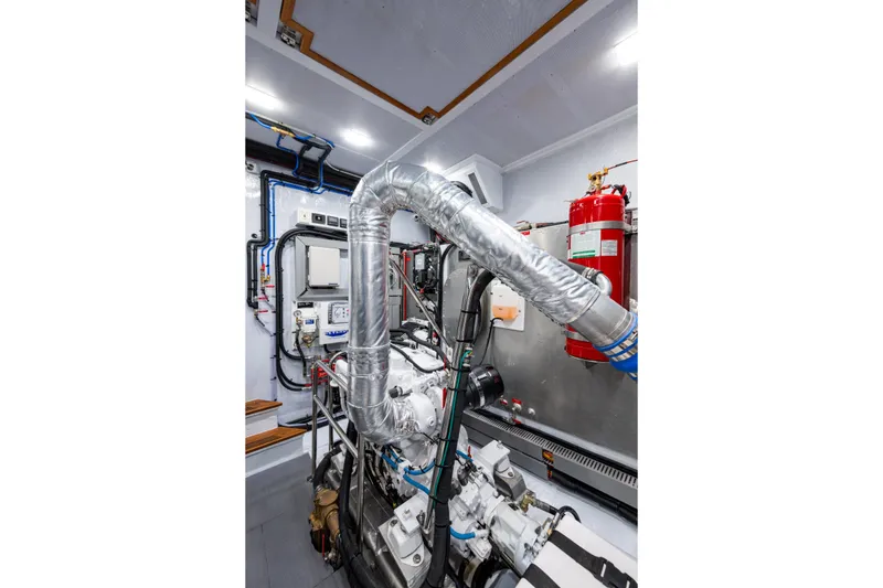 Slide: The Image of Engine room of 2026 Kadey-Krogen 60 Open yacht, featuring advanced machinery and fire safety equipment. - 63