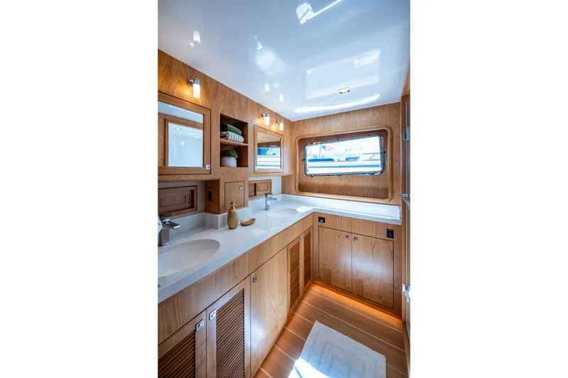 Slide: The Image of Luxurious bathroom interior of 2026 Kadey-Krogen 60 Open yacht with wooden cabinetry. - 32