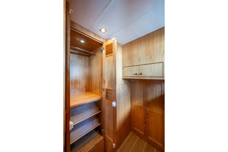 Slide: The Image of Wooden interior closet on 2026 Kadey-Krogen 60 Open yacht, featuring shelves and storage. - 30