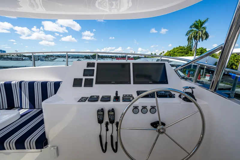 Slide: The Image of Helm of 2026 Kadey-Krogen 60 Open yacht with navigation screens and steering wheel. - 93