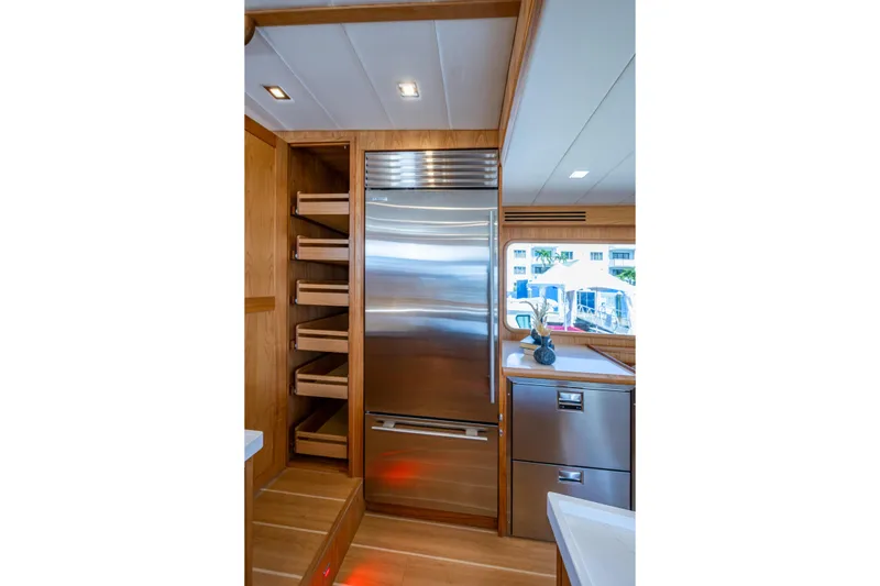 Slide: The Image of Modern kitchen interior of 2026 Kadey-Krogen 60 Open yacht with stainless steel appliances. - 12
