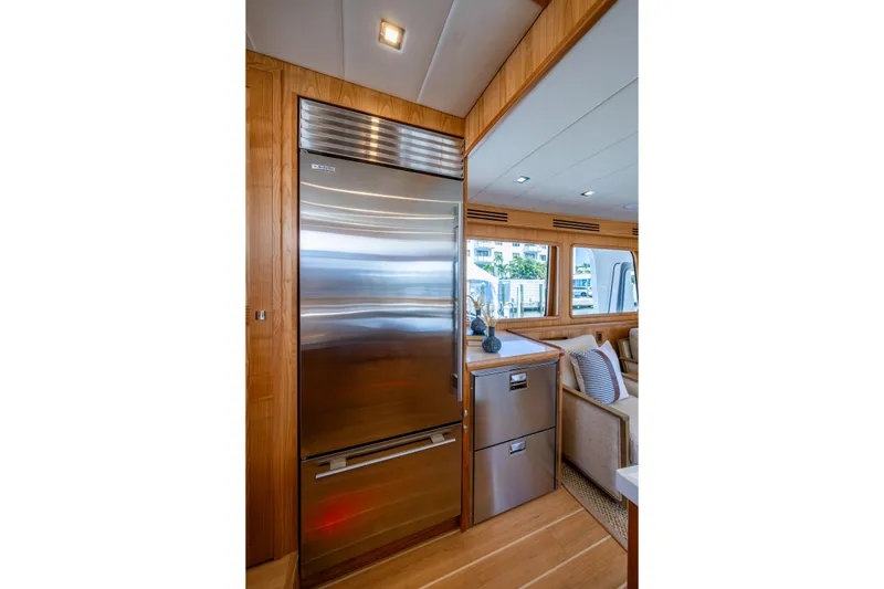 Slide: The Image of Luxurious interior of 2026 Kadey-Krogen 60 Open yacht with modern kitchen appliances. - 11