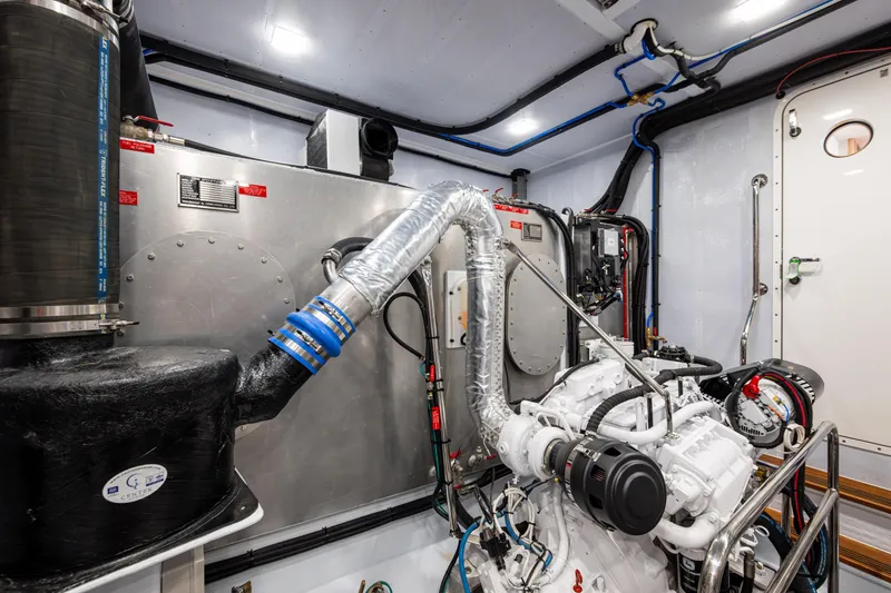 Slide: The Image of Engine room of 2026 Kadey-Krogen 60 Open yacht, showcasing advanced machinery and piping. - 62
