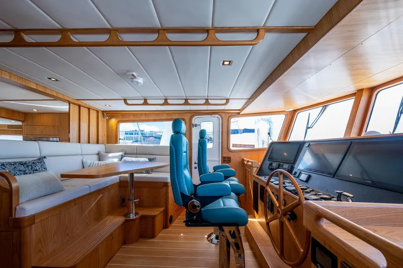 Slide: The Image of Luxurious interior of 2026 Kadey-Krogen 60 Open yacht with modern helm and seating. - 17