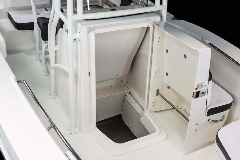 Slide: The Image of Manufacturer Provided Image: 2025 Robalo R202 Explorer boat interior with open storage compartment. - 16