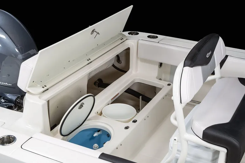 Slide: The Image of Manufacturer Provided Image: 2025 Robalo R202 Explorer boat interior with open storage compartments and seating. - 14