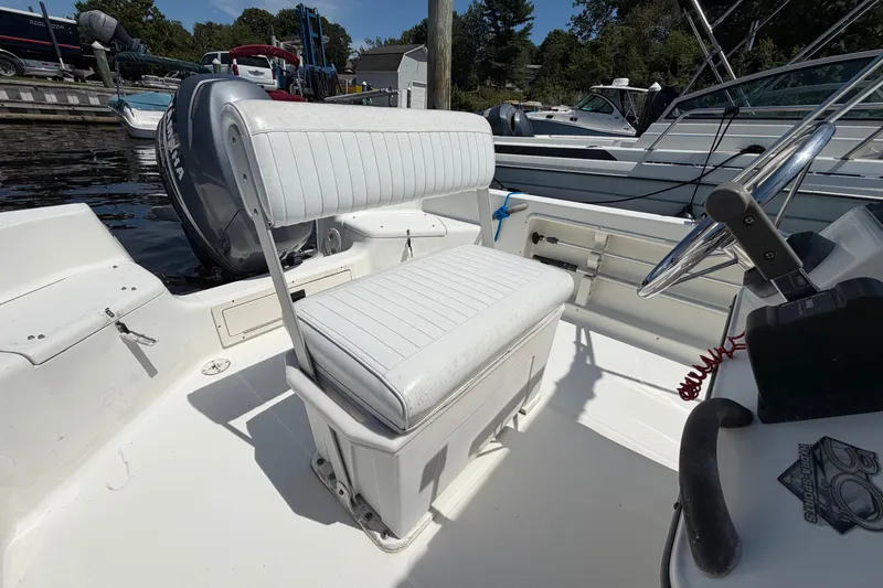 Slide: The Image of 2003 Hydra-Sports 180 CC boat interior with white seating and steering wheel. - 11