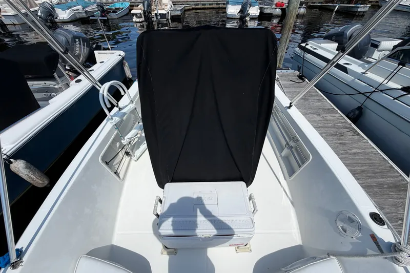 Slide: The Image of 2003 Hydra-Sports 180 CC boat interior with covered console, docked at marina. - 8