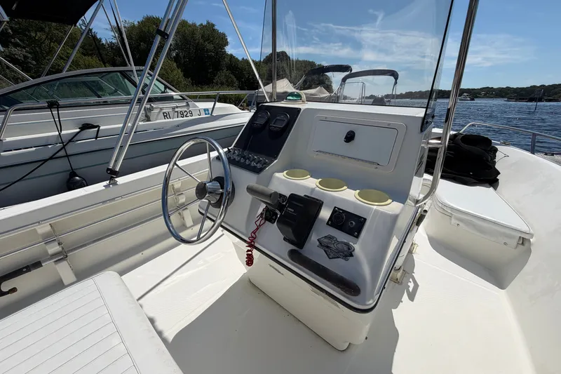 Slide: The Image of 2003 Hydra-Sports 180 CC boat interior with steering wheel and control panel. - 13