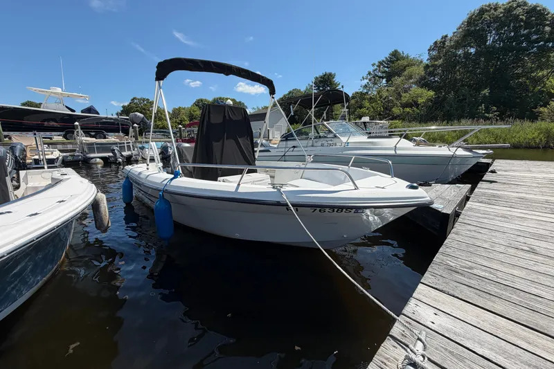 The Image of 2003 Hydra-Sports 180 CC boat docked at marina, surrounded by other vessels. - 0