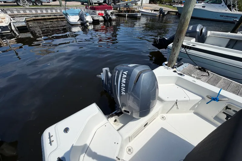 Slide: The Image of 2003 Hydra-Sports 180 CC boat with Yamaha outboard motor docked at marina. - 5